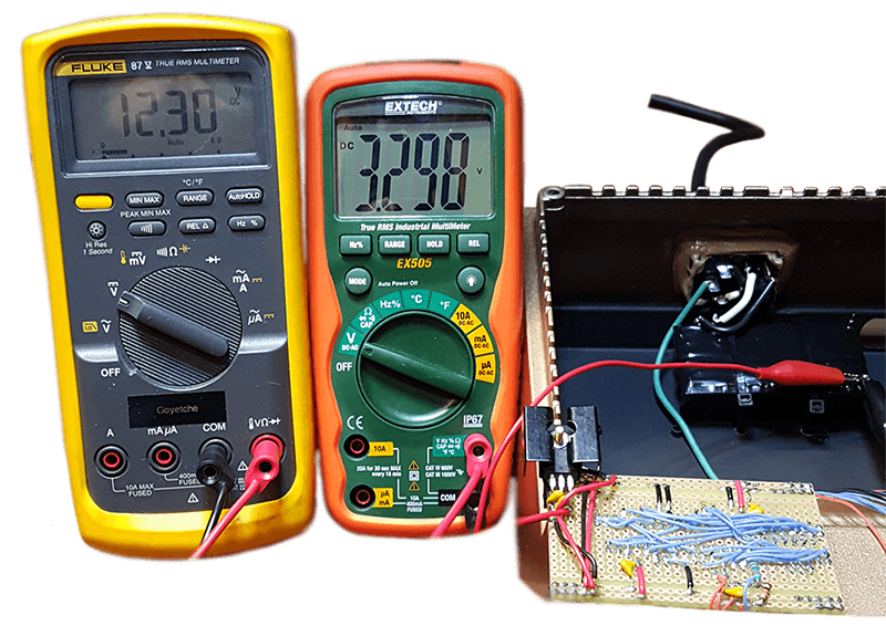 Multimeter verification showing 12.3V and 3.3V power rails