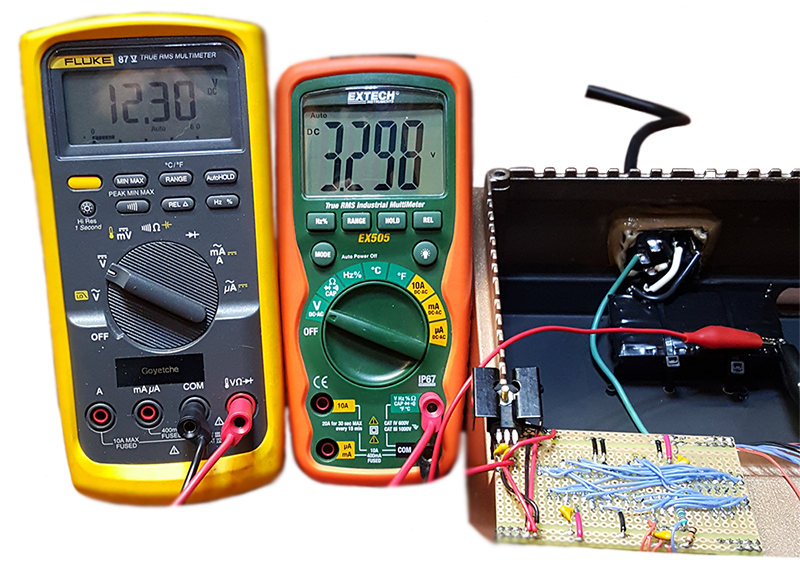 Multimeter verification showing 12.3V and 3.3V power rails